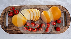 Cheese collection, Italian cheese scamorza, caciocavallo, provolone made from cow milk in South Italy yellow smoked cheese