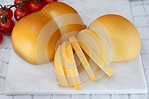 Cheese collection, Italian cheese scamorza, caciocavallo, provolone made from cow milk in South Italy yellow smoked cheese