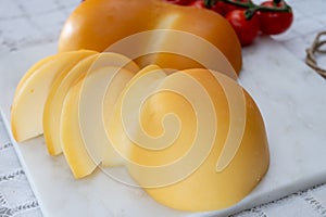 Cheese collection, Italian cheese scamorza, caciocavallo, provolone made from cow milk in South Italy yellow smoked cheese