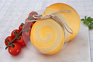 Cheese collection, Italian cheese scamorza, caciocavallo, provolone made from cow milk in South Italy yellow smoked cheese