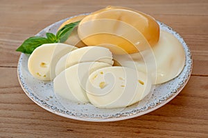 Cheese collection, variety of Italian cow milk cheese flat scamorza
