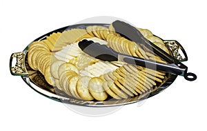 Cheese and crackers served on a metal tray