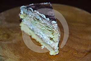 Cheese cream cake served on a wooden dish