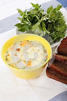 Cheese cream soup in yellow bowl