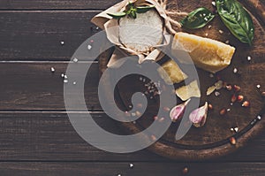 Cheese delikatessen closeup on rustic wood, brie and parmesan photo