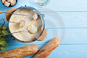 Cheese fondue with bread wine and grape