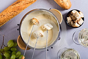 Cheese fondue with bread wine and grape