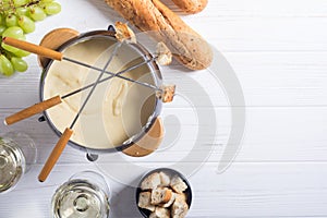 Cheese fondue with bread wine and grape