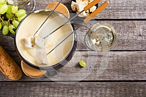 Cheese fondue with bread wine and grape