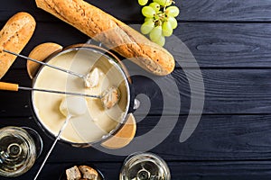 Cheese fondue with bread wine and grape