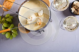 Cheese fondue with bread wine and grape