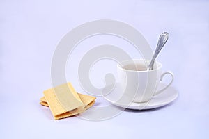 Cheese fruit snacks and a cup of coffee on white background