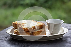 Cheese garlic bread in ceramic plateo.