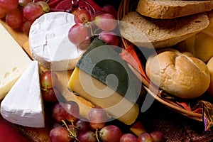 Cheese and grapes, still life