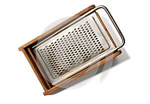 cheese grater classic wooden and metal white background,vintage kitchen utensil