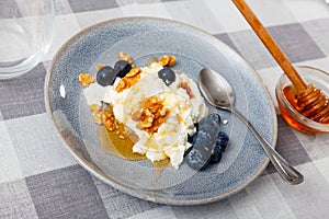 Cheese and honey dessert with honey, walnuts and blueberries - Mato con miel - Catalan cuisine photo