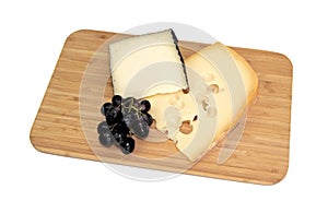 Cheese on kitchen board, isolated on white background