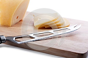 Cheese knife on cutting board