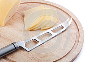 Cheese knife on cutting board