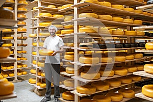 Cheese maker at the cheese storage