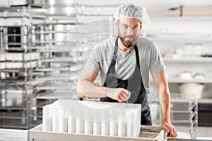 Cheese maker at the manufacturing