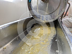 Cheese making press dairy butter whey artisan making hydraulic factory milk cows raw pasteurised squeezed pressed cheddar photo