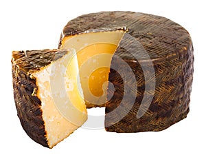 Cheese manchego with cut piece photo