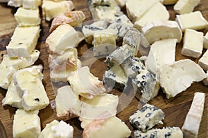 Cheese with mold on a wooden Board