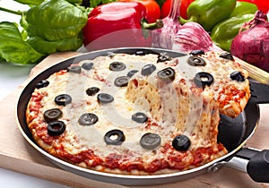 Cheese and olive pizza, one slice lifted up