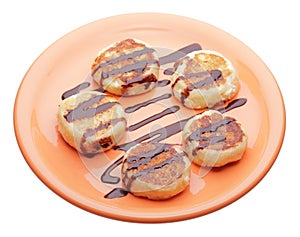 Cheese pancakes with chocolate syrup