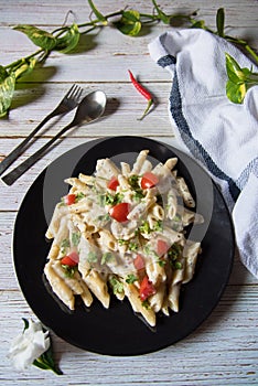 Cheese pasta with vegetables on a plate