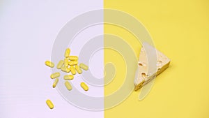 Cheese and pills, pasteurized products with organic bacteria, lactose, macro photo