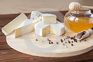 Cheese plate with Brie, Camembert, Roquefort photo