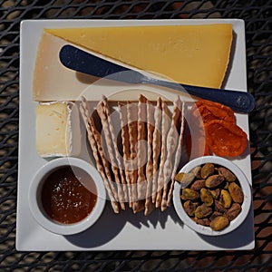Cheese plate with crackers and nuts