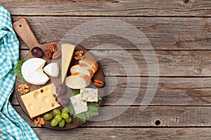 Cheese plate with grapes and nuts