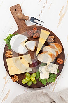 Cheese plate with grapes and nuts