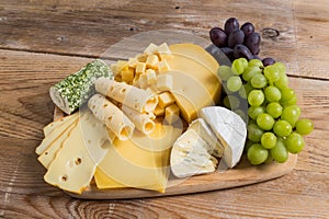 Cheese plate variation on a wooden table
