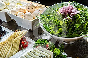 Cheese plates with greens.