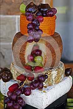 Cheese platter with fresh and glazed fruit