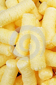 Cheese puff. Cheese puffs snack background texture food pattern.