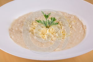Cheese Risotto Italian Cuisine. Made with rice arboreo and Grana Padano cheese photo