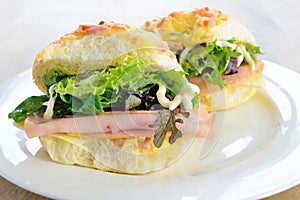 Cheese rolls with ham and salad