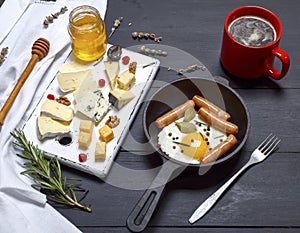 Cheese and a round cast-iron frying pan with fried egg