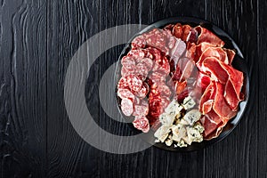 Cheese, sausages, dry aged pork meat, top view