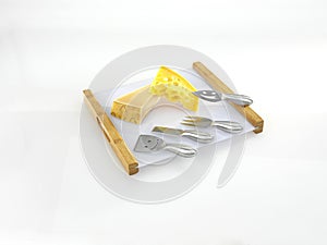 cheese serving on a tray with cheese cutters