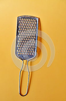 Cheese slicer isolated on yellow background