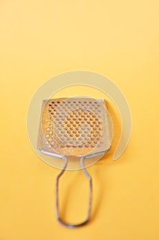 Cheese slicer isolated on yellow background