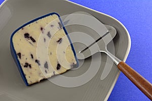 Cheese slicer and Wensleydale cheese with blueberries