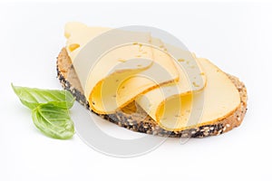 Cheese slices on bread. White background.