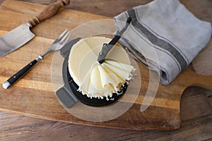 cheese slicing machine on table, natural and high-quality products, traditions and peculiarities of dining